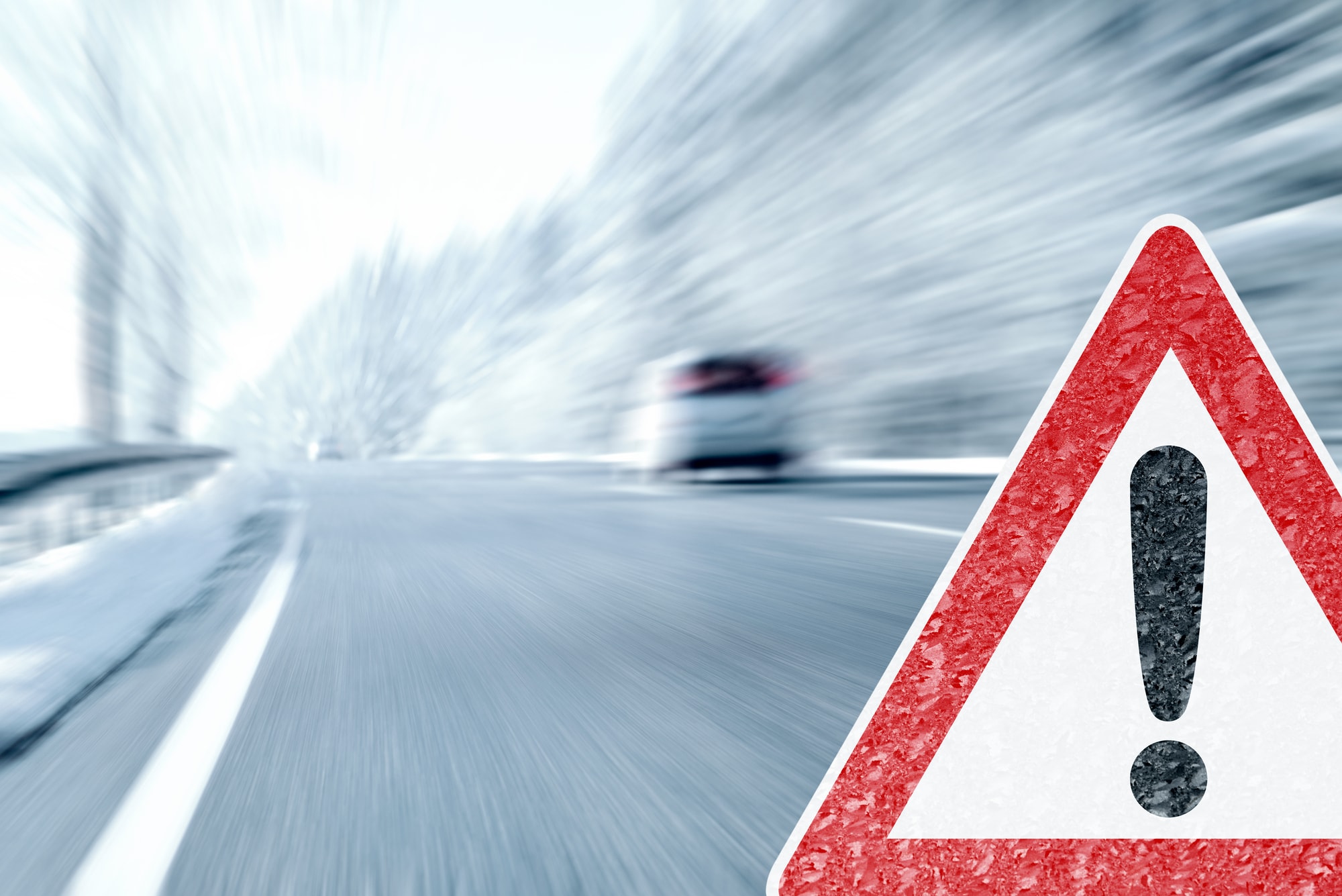 Warning sign on snowy road