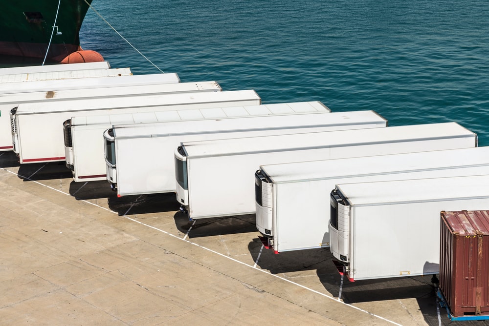 Refrigerated trailers parked along a dock