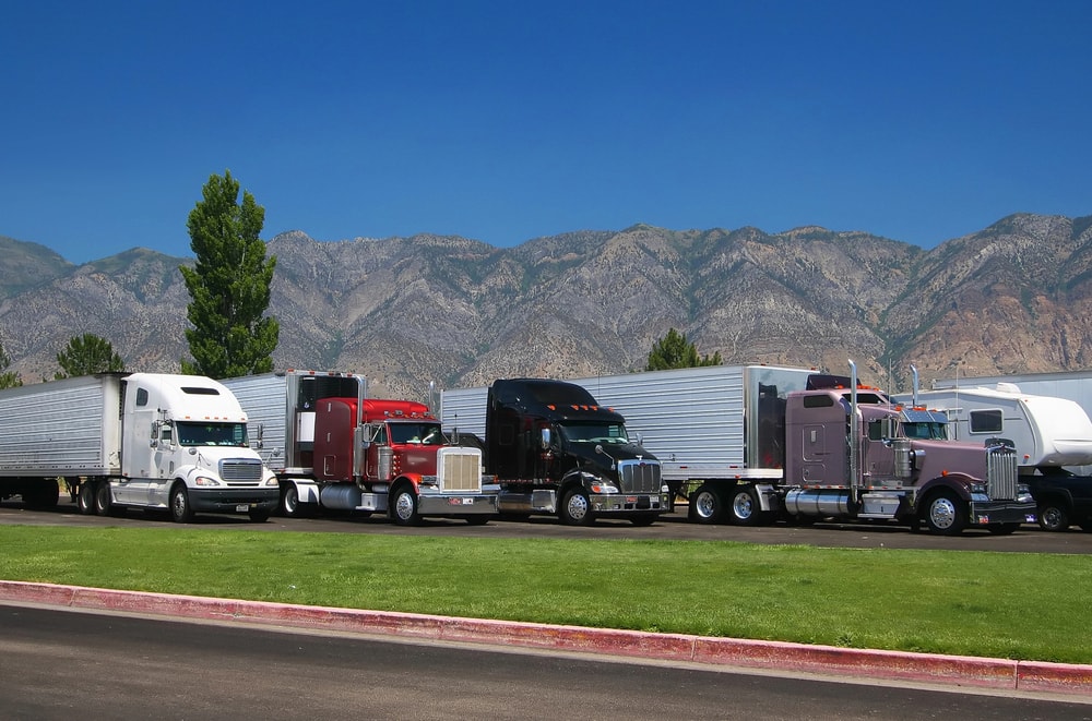 semi trucks parked in parking lot