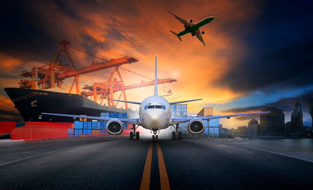 Plane with cargo behind it at loading dock