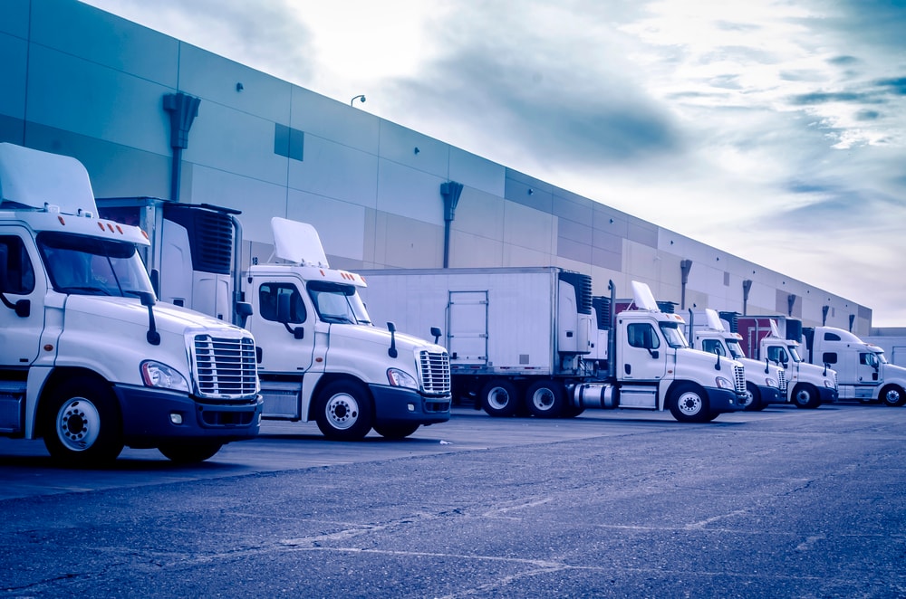 Trucks lined up at a warehouse