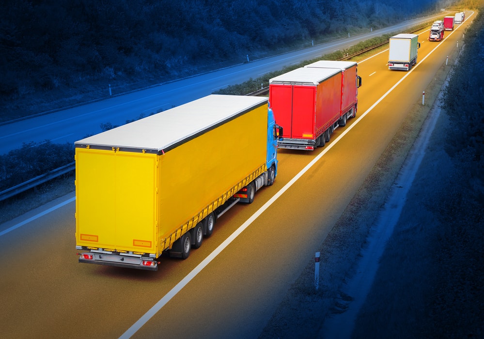 Brightly colored trucks on the road