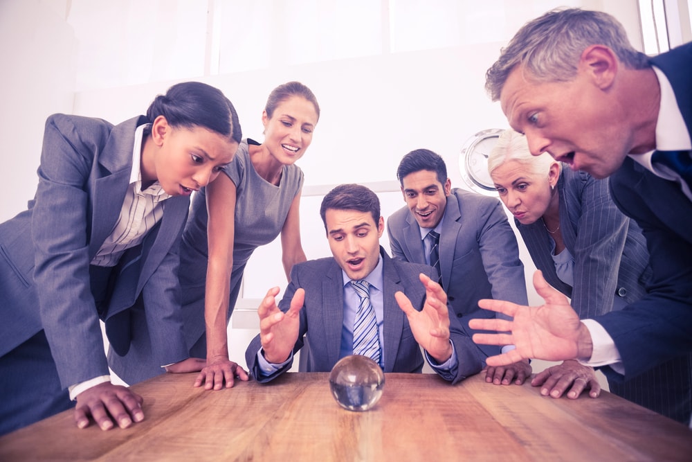 Business people crystal ball