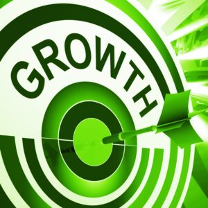 growth on green dart board with dart on bullseye