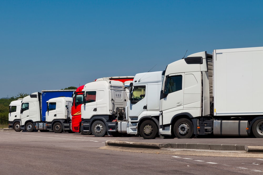 cab over engine trucks in a row