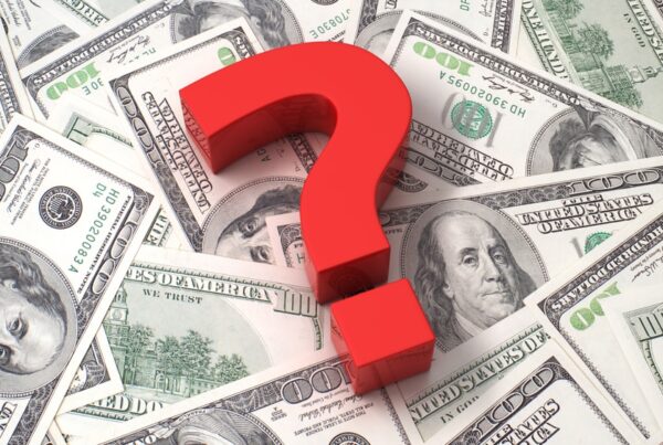 Question mark on money spread out