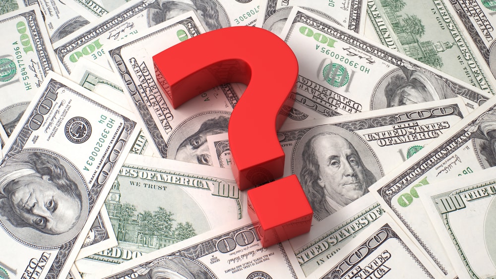 Question mark on money spread out