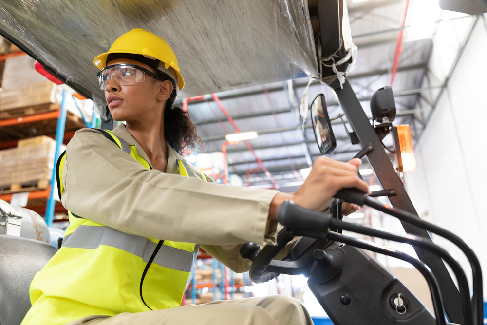 female operating a pallet jack